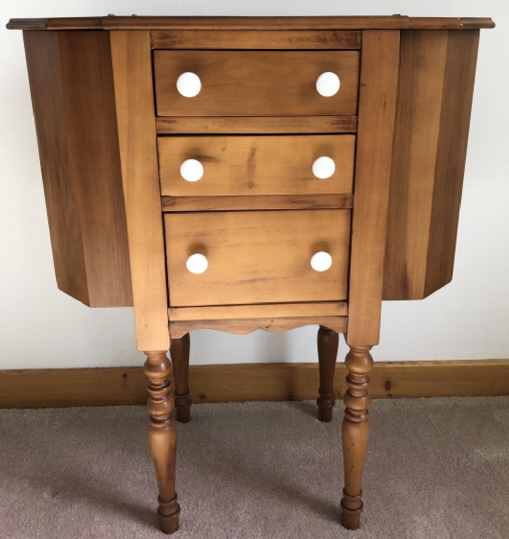 American Country Style Pine Sewing Cabinet / Table: American Country Style Pine Sewing Cabinet / Table. Having three pull out drawers and carved legs. 28 inches x 23 inches x 12 inches.