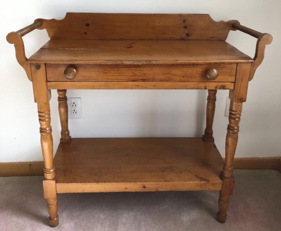American Country Style Pine Dry Sink: American Country Style Pine Dry Sink. Having carved balusters, a lower shelf and one pull-out drawer. 32 inches x 35 inches x 15 inches.