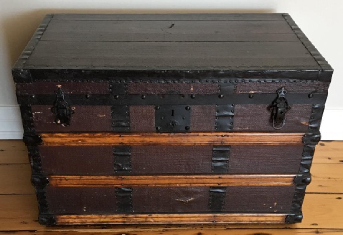 Antique Wooden Steamer Trunk: Antique Wooden Steamer Trunk. Having metal hardware and wooden slat construction. 22 inches x 32 inches x 20 inches. Property of a designer decorated Greenwich, Connecticut estate.