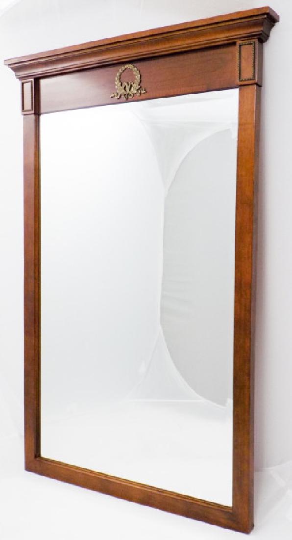 Neoclassical Style Pier Mirror W Ormolu Detail: Neoclassical Style Pier Mirror W Ormolu Detail. Beveled mirror with brass ormolu detail and acanthus wreath motif. 38.5 inches x 25.5 inches x 2.5 inches.