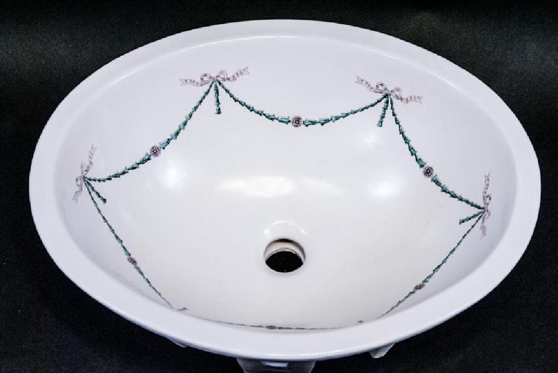 Shabby Chic Style Ceramic Sink: Shabby Chic Style Ceramic Sink. This ceramic kitchen or bathroom sink features a shabby chic style pink ribbon and green wreath motif decal. 7 inches x 19.5 inches x 15.5 inches.