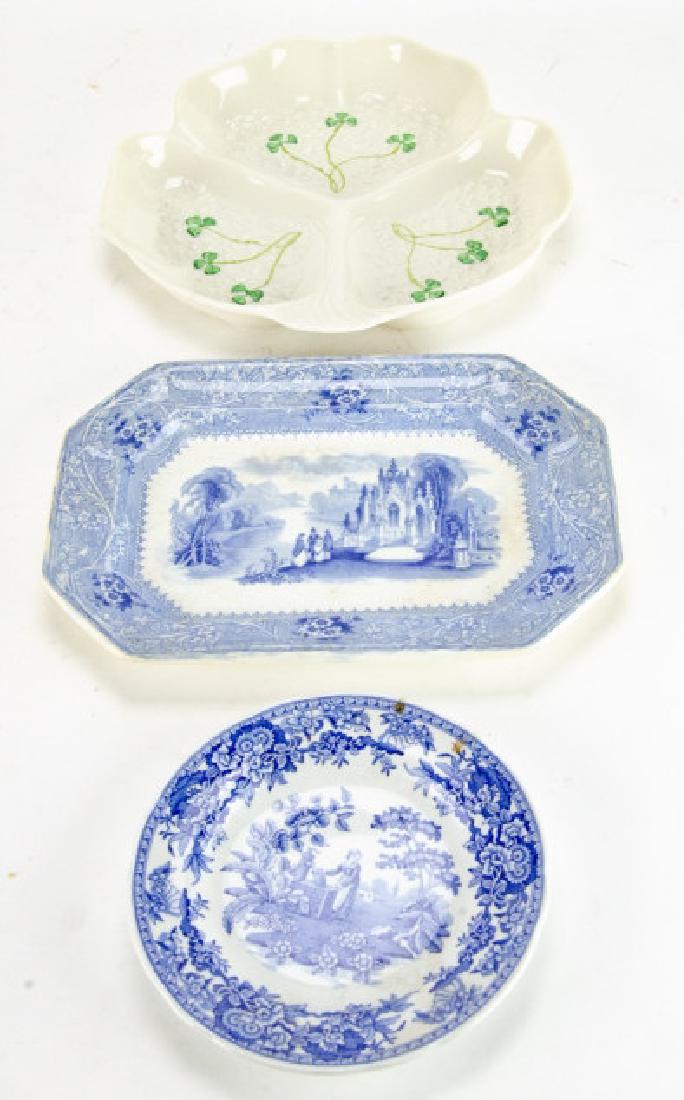 Lot of Porcelain & Ironstone Serve Ware Pieces: Lot of Porcelain & Ironstone Serve Ware Pieces. This lot includes one reproduction Spode plate, one small ironstone platter, and one porcelain serving dish. Largest piece measures approximately 10 inc