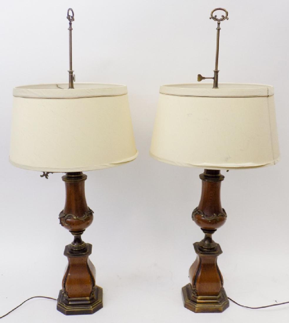 Pair of Large Baroque Style Wood + Brass Lamps: Pair of Large Baroque Style Wood + Brass Lamps. Wood and rubbed brass balustrade form lamps with rubbed brass ormolu detail, inner milk glass shade and exterior cloth shade. 44 inches x 18 inches in d