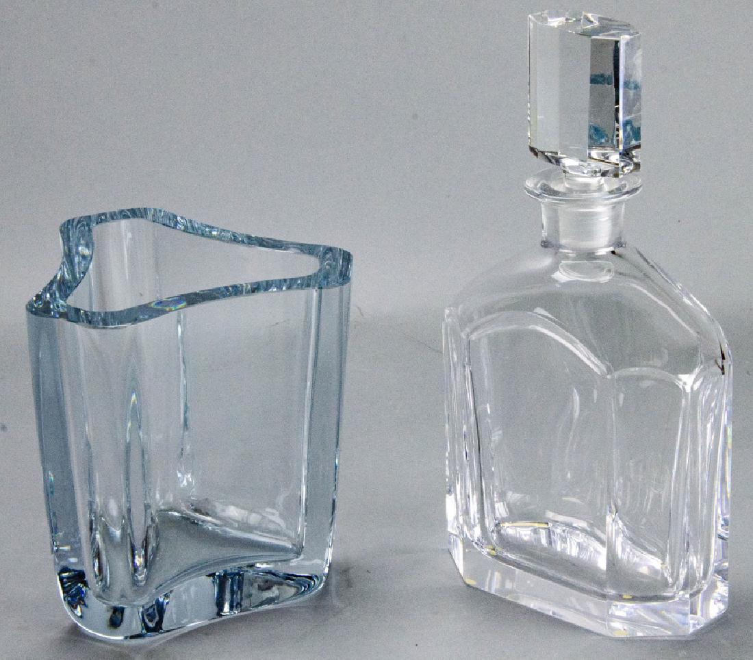 Orrefors Crystal Decanter & Swedish Crystal Vase: Orrefors Crystal Decanter & Swedish Crystal Vase. This lot includes one crystal Orrefors decanter and one Swedish Strombergshyttan vase. Both feature a modernist design and are signed on the bottom. P