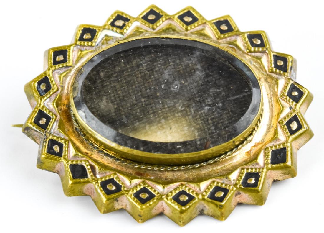 Antique 19th C Glass Front Locket Mourning Brooch: Antique 19th C Glass Front Locket Mourning Brooch. Gold filled with black enamel details. Measures 1.5 inches in length.