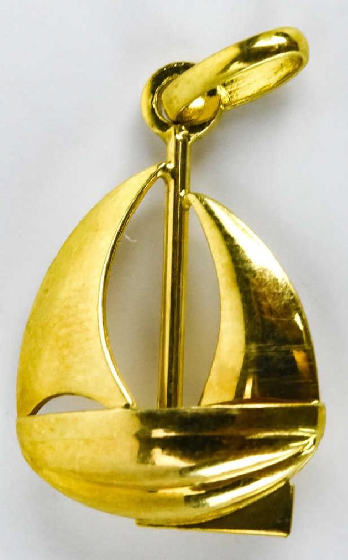 18K Gold Figural Sail Boat Charm: 18K Gold Figural Sail Boat Charm. Charm is approximately one inch tall. 1.5 DWT