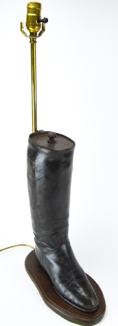 Antique Riding Boot W Wooden Stretcher Table Lamp: Antique Riding Boot W Wooden Stretcher Table Lamp. Table lamp with antique leather riding boot with wooden stretcher insert on a base. 28 inches x 6 inches x 11 inches.