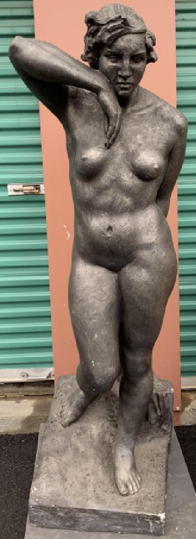 Life Size Terracotta Figural Female Nude Statue: Life Size Terracotta Figural Female Nude Statue. This life size figural female nude statue is painted in a pewter tone. 63 inches x 18 inches x 19 inches.
