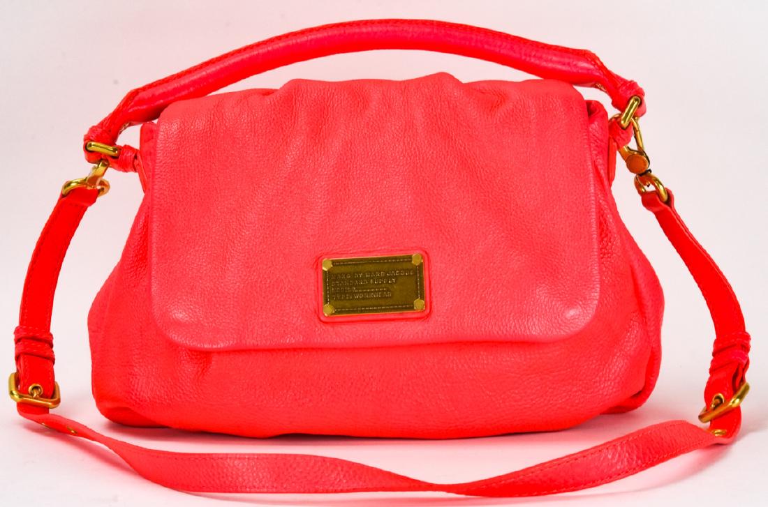 Marc by Marc Jacobs Neon Leather Handbag / Purse: Marc by Marc Jacobs Neon Leather Handbag / Purse. Neon pink with gold toned hardware. Black and white fabric lined. Measures approximately 9 inches x 12 inches x 3.5 inches without straps. Property of