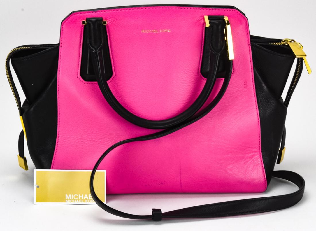 Michael Kors Leather Handbag / Purse: Michael Kors Leather Handbag / Purse. Pink and black leather handbag with gold toned hardware by Michael Kors. Measures approximately 9 inches x 13 inches x 4.5 inches. Property of an Irvington, New Y