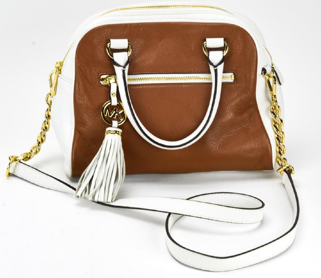 Michael Kors Leather Handbag / Purse: Michael Kors Leather Handbag / Purse. Brown and white leather purse by Michael Kors. Measures approximately 8.5 inches x 10.5 inches x 4 inches. Property of an Irvington, New York estate.