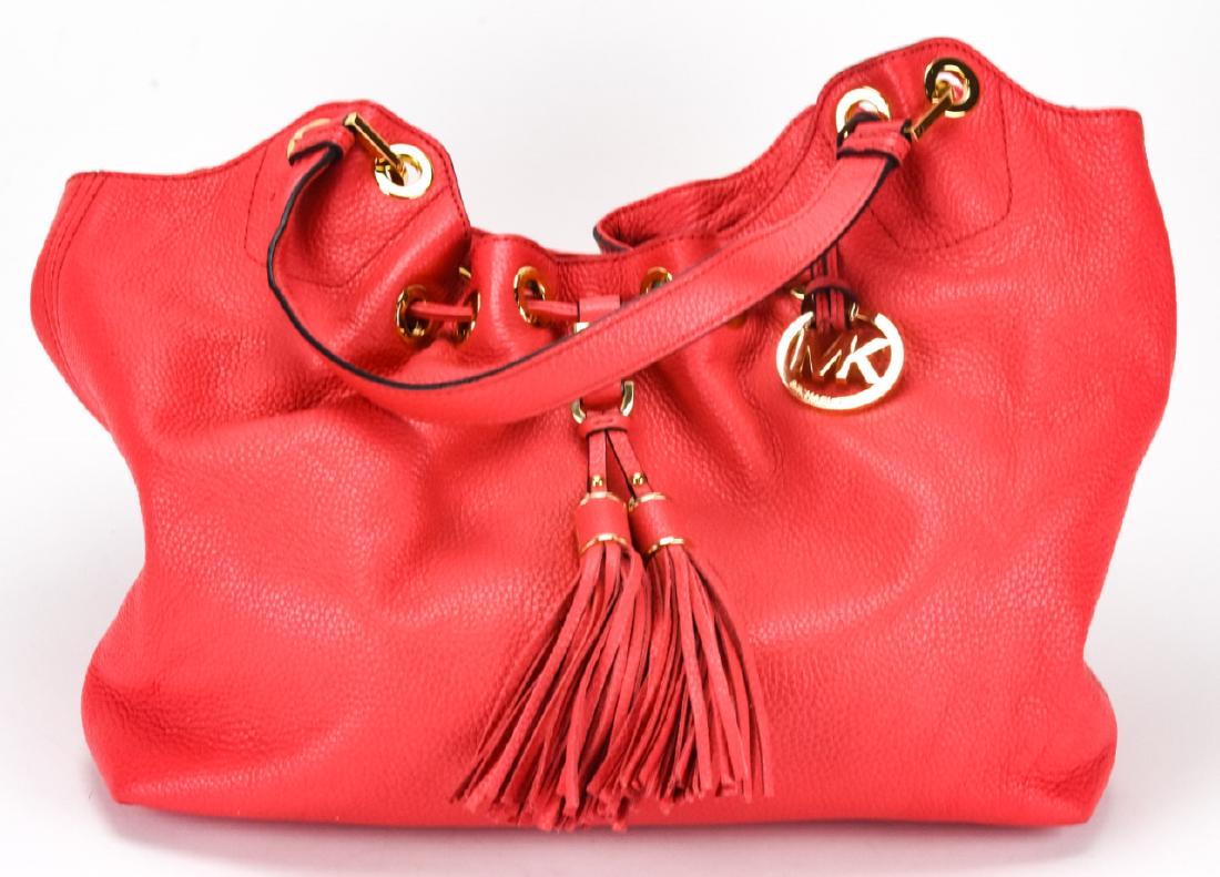 Michael Kors Leather Handbag / Purse: Michael Kors Leather Handbag / Purse. Pink leather purse with gold toned hardware by Michael Kors. With original care card. Measures approximately 12 inches x 15 inches x 5 inches without straps. Prop