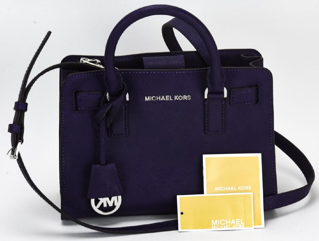 Michael Kors Dillon Leather Handbag / Purse: Michael Kors Dillon Leather Handbag / Purse. Purple leather purse by Michael Kors. New with original tags. Originally retails for $228. Measures approximately 7.5 inches x 9.5 inches x 4.5 inches. Pro