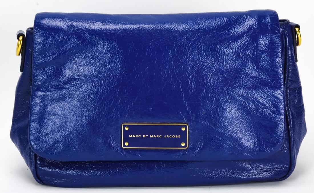 Marc by Marc Jacobs Leather Handbag / Purse: Marc by Marc Jacobs Leather Handbag / Purse. Blue cow leather clutch handbag by Marc by Marc Jacobs. Gold toned hardware. Measures approximately 8 inches x 11 inches x 4 inches. Property of an Irvingt