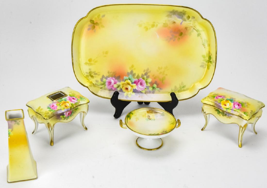 Japanese Nippon Porcelain 5 Piece Vanity Suite: Japanese Nippon Porcelain 5 Piece Vanity Suite. Five piece vanity suite with hand painted floral motif, marked on bottom. Plateau measures 11 inches x 7 inches. Property of an Irvington, New York esta