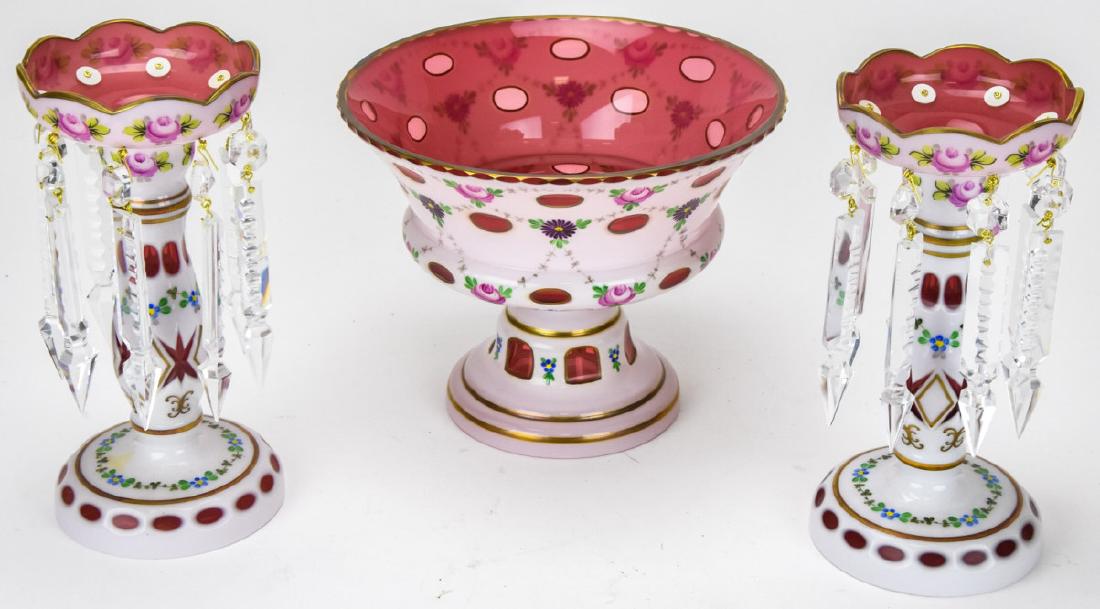 Hand Painted Bohemian Glass Centerpiece Trio: Hand Painted Bohemian Glass Centerpiece Trio. Three piece Bohemian glass centerpiece set with hand painted floral details. Includes centerpiece compote and two candle holders with crystal pendalogs. P