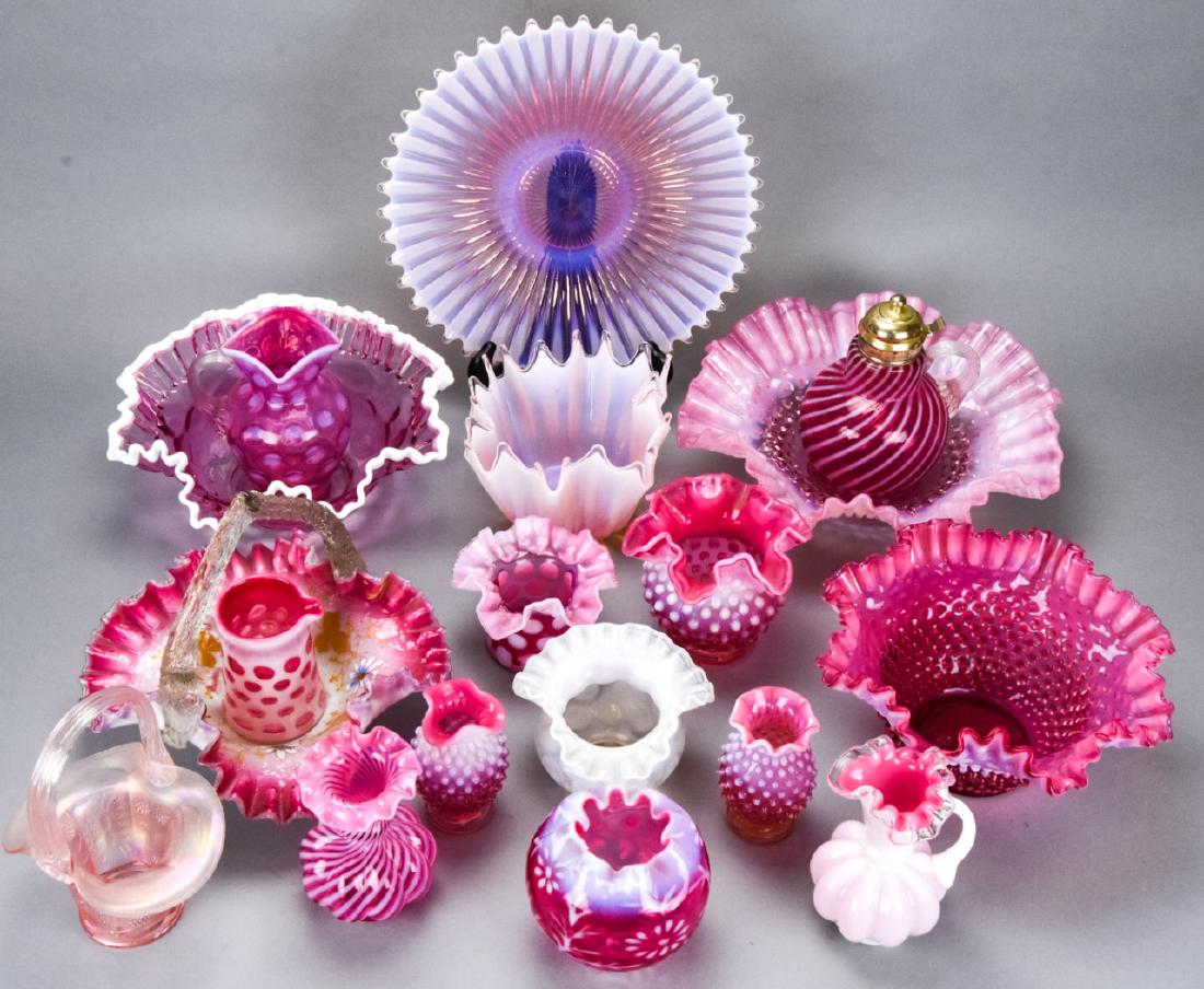 Lot of Fenton Style Cranberry & Milk Glass Objects: Lot of Fenton Style Cranberry & Milk Glass Objects. Includes hobnail, fluted, ribbon, thumbnail, and other styles of glass centerpieces. Larger measures 6 inches x 12 inches in diameter. Property of a