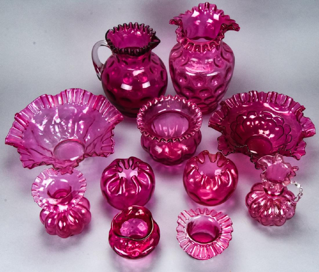 Lot of Fenton Style Cranberry Glass Centerpieces: Lot of Fenton Style Cranberry Glass Centerpieces. Includes ribbon, thumbprint, and fluted designs. Larger vase measures 10 inches x 6.5 inches in diameter. Property of an Irvington, New York estate.