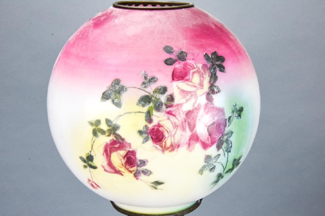 Gone With The Wind Hand Painted Glass Oil Lamp: Gone With The Wind Hand Painted Glass Oil Lamp. Features hand painted rose motif glass. Knob is marked Success. Measures 22 inches x 8 inches in diameter. Property of an Irvington, New York estate.