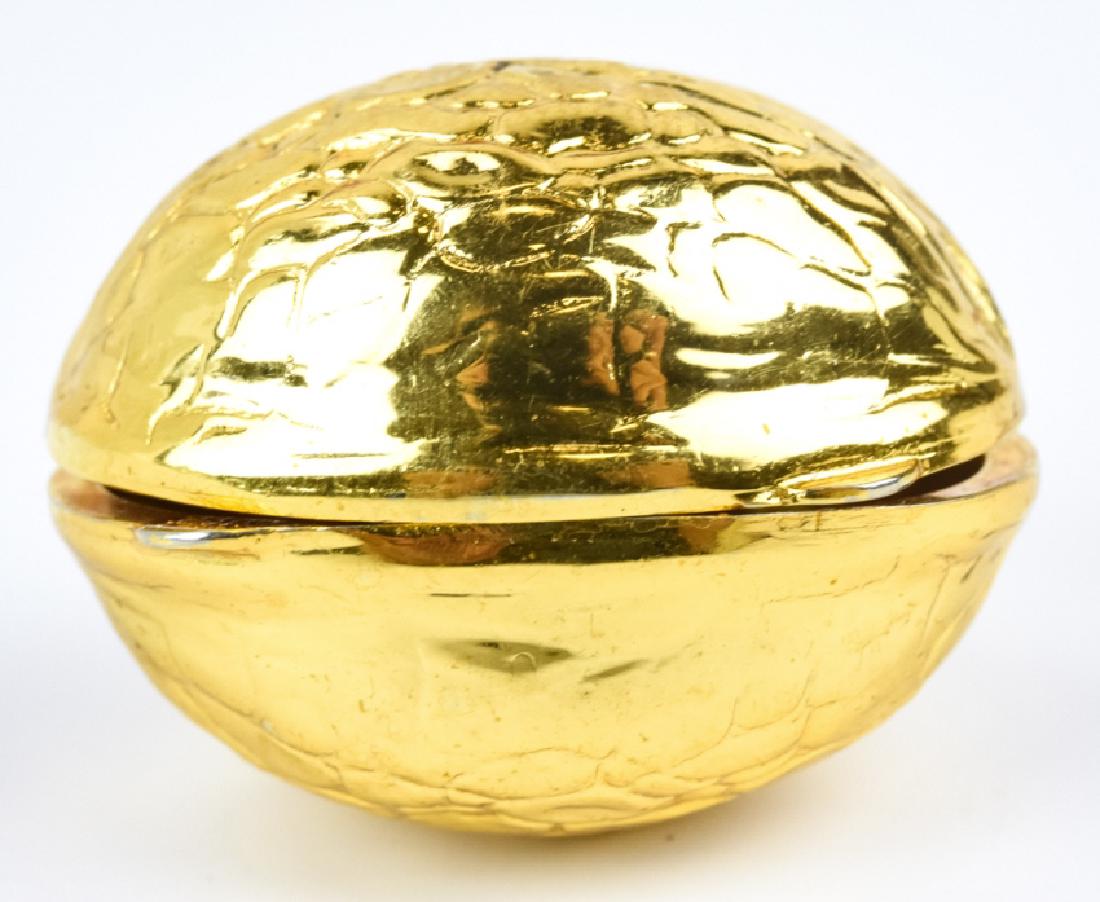 Vintage Italian Gilt Ormolu Walnut Pill Box: Vintage Italian Gilt Ormolu Walnut Pill Box. Marked made in ITALY. Measures 1.5 inches in length.