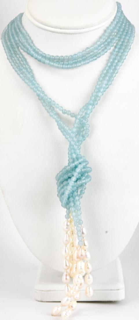 Triple Strand Baroque Pearl & Aqua Bead Necklace: Triple Strand Baroque Pearl & Aqua Bead Necklace. Knotted with tassel design. Measures 32 inches plus 5 inch dangle.