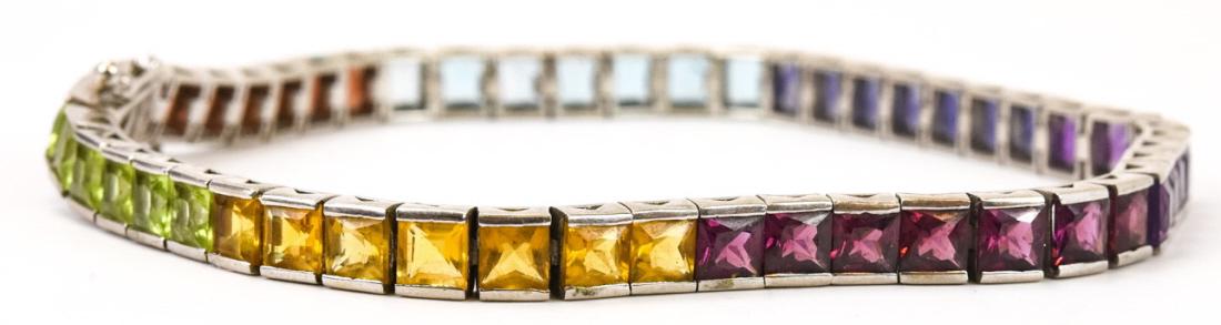 Sterling Silver & Rainbow Crystal Tennis Bracelet: Sterling Silver & Rainbow Crystal Tennis Bracelet. Measures just over 8.25 inches in length.