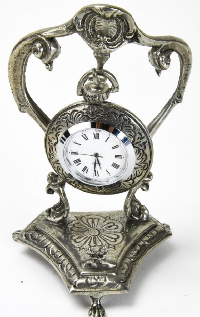 Vintage Etain Fin-Zinn Pewter Hanging Clock: Vintage Etain Fin-Zinn Pewter 95% Hanging Clock. Vintage French pewter quartz pocket watch / small clock on a cast pewter display stand. Stamped at base, Etain 95%, clock is stamped 95. 5 inches x 4 i