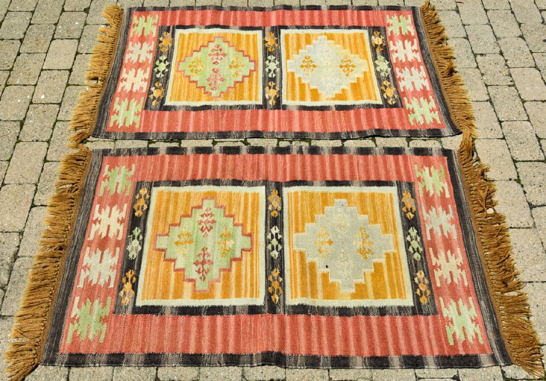 2 Native American Style Woven Throw Rugs / Carpets: 2 Native American Style Woven Throw Rugs / Carpets. Native American / Navajo style throw rugs, fringed on two sides. Measure approximately 46 inches x 28 inches without fringe.