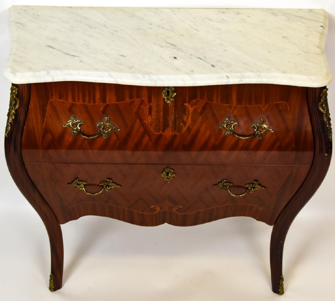 Louis XVI Style Veneer & Marble Top Bombe Chest: Louis XVI Style Veneer & Marble Top Bombe Chest. Features two pull out drawers and brass ormolu details. Measures approximately 27 inches x 28 inches x 15 inches.