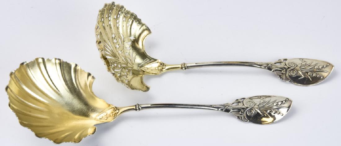 2 Antique Mansfield Baird Sterling Serving Spoons: 2 Antique Mansfield & Baird Sterling Serving Spoons. Two antique sterling silver serving spoons, marked for Mansfield & Baird. Larger measures 8.75 inches x 3.25 inches.