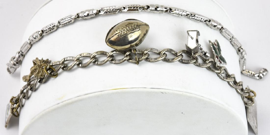 2 Sterling Silver Charm & Link Bracelets: 2 Sterling Silver Charm & Link Bracelets. This lot includes one sterling silver charm bracelet with charms and one sterling silver link bracelet. Charm bracelet measures 7 inches in length.