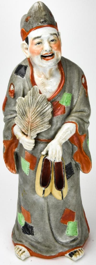 Chinese Hand Painted Porcelain Sage Statue: Chinese Hand Painted Porcelain Sage Statue. Figural porcelain Chinese statue depicting a sage holding a palm leaf and a pair of shoes. Features all over hand painted details. Measures approximately 21