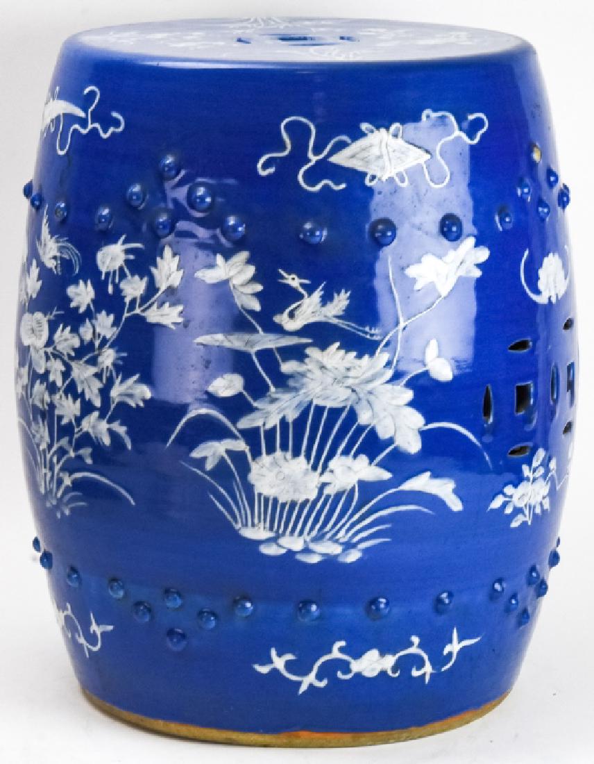Chinese Blue & White Porcelain Garden Stool: Chinese Blue & White Floral Motif Porcelain Garden Stool. Porcelain garden stool featuring a blue and white floral motif. 18 inches x 13.5 inches.