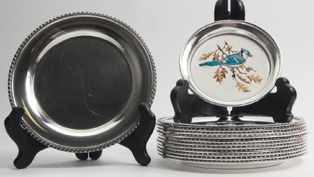 Set of Silver Plated Serving Plates: Set of Silver Plated Serving Plates. 12 silver plated bread plates and one silver plated bird motif wine coaster. Larger measures 6.25 inches in diameter.
