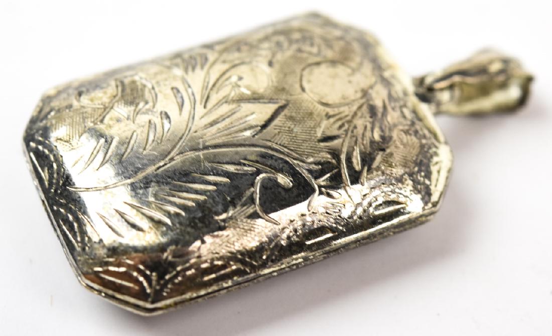 Vintage Sterling Silver Chased Work Locket Pendant: Vintage Sterling Silver Chased Work Locket Pendant. Measures 1.75 inches in length.