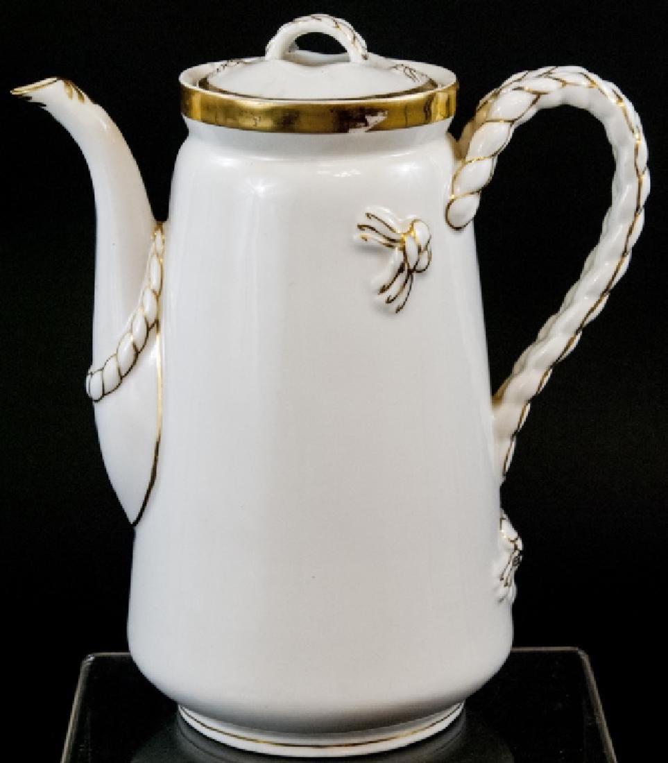 Antique Limoge White Porcelain Pitcher: Antique Limoge White Porcelain Pitcher, this pitcher features a gold leaf around the handle and rim of spout of the pitcher, it has Limoges stamped on the bottom and is measured at 10 x 9 inches