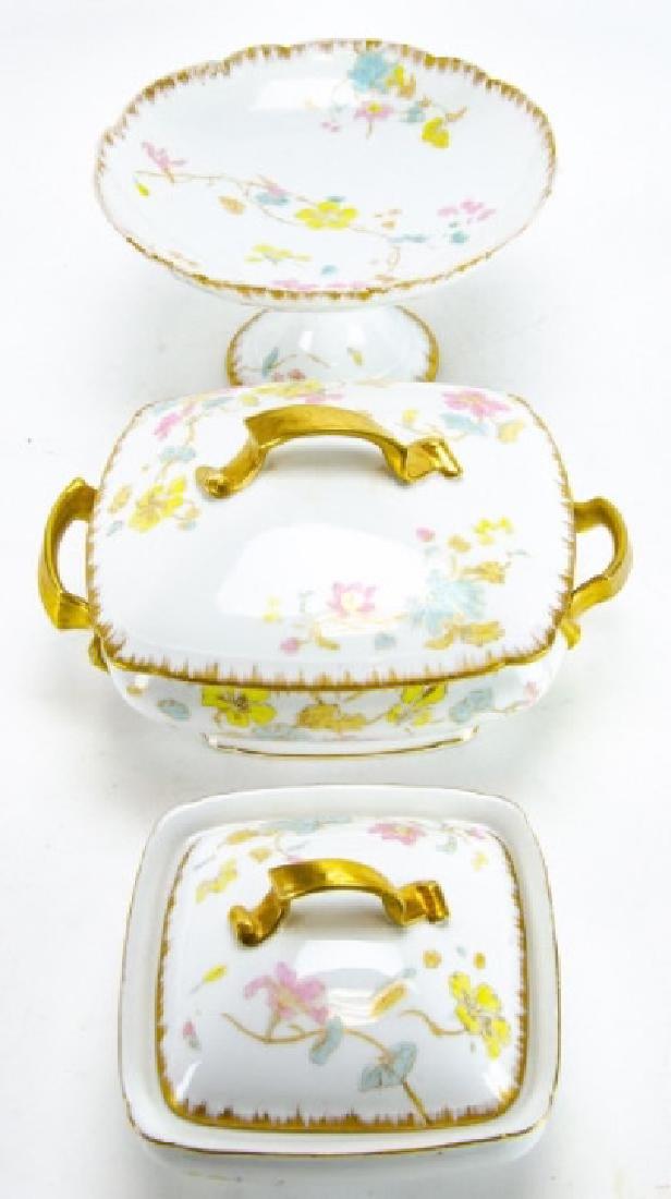 Antique D & C Limoges French Porcelain Serveware: Antique D & C Limoges French Porcelain Serveware Pieces. This lot features three pieces of antique D & C Limoges porcelain serveware, including two lidded tureens and one compote. Compote measures 5 i