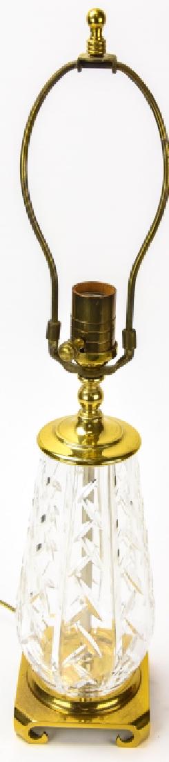 Waterford Cut Crystal Table Lamp: Waterford Cut Crystal Table Lamp. On a brass base. Measures 23 inches x 4.5 inches x 4.5 inches with harp.