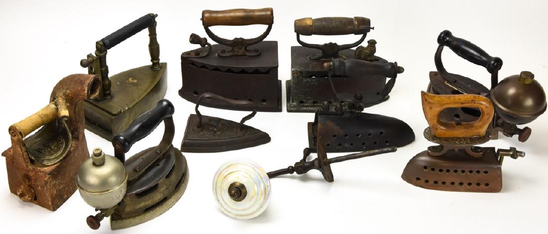 Lot of Antique Cast Metal Irons: Lot of Antique Cast Metal Irons. Varying sizes / styles. Larger measures approximately 9 inches x 14 inches x 3.5 inches.