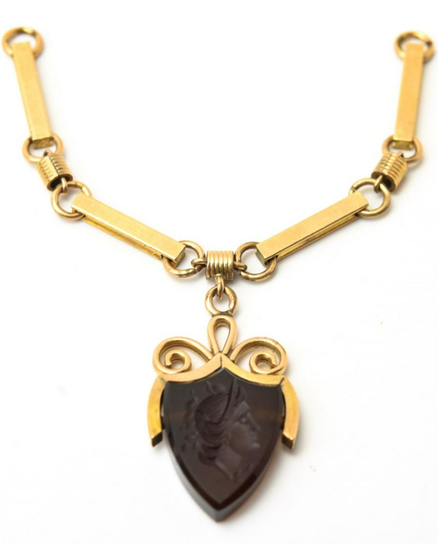 Antique 19th C Onyx Intaglio Necklace Pendant: Antique 19th C Onyx Intaglio Necklace Pendant. Shield form Greco-Roman soldier. Measures 3.25 inches in length.