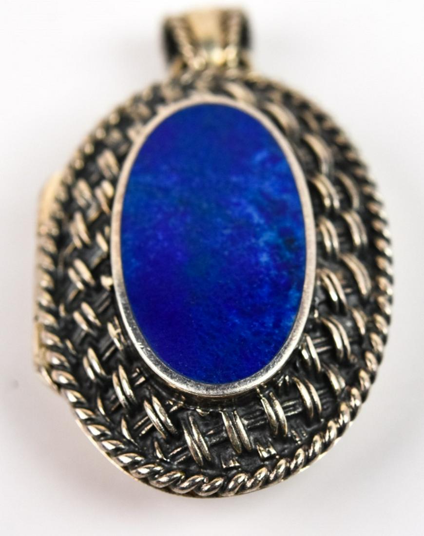 Repousse Sterling Silver & Lapis Lazuli Locket: Repousse Sterling Silver & Lapis Lazuli Locket . Locket necklace pendant with basket weave design. Hallmarked. Measures just over 1.5 inches.