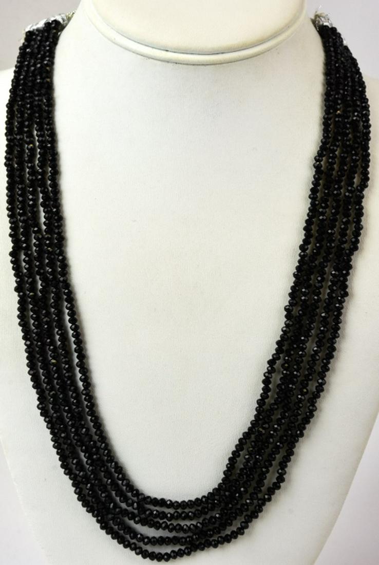 Multi Strand Faceted Black Spinel Necklace: Multi Strand Faceted Black Spinel Necklace. Longest strand measures 24 inches in length.