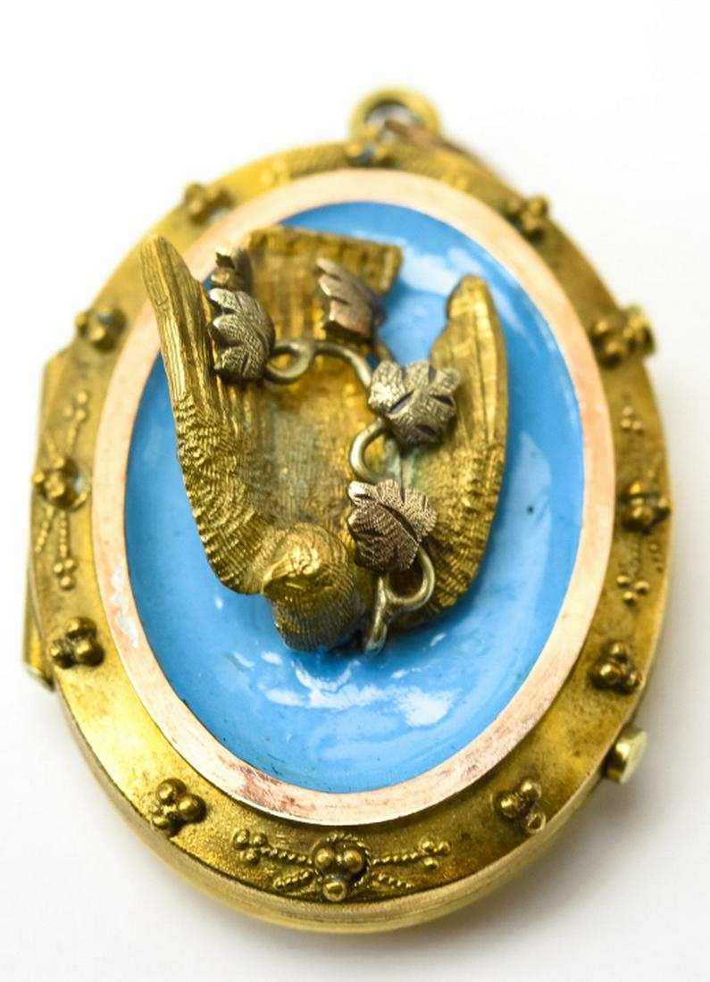 Antique 19th C Gold & Enamel Swallow Locket: Antique 19th C Gold & Enamel Swallow Locket. Gold filled with yellow gold topped oval frame, robins egg blue enamel background with sculptural bird center. Measures 1.5 inches in length.