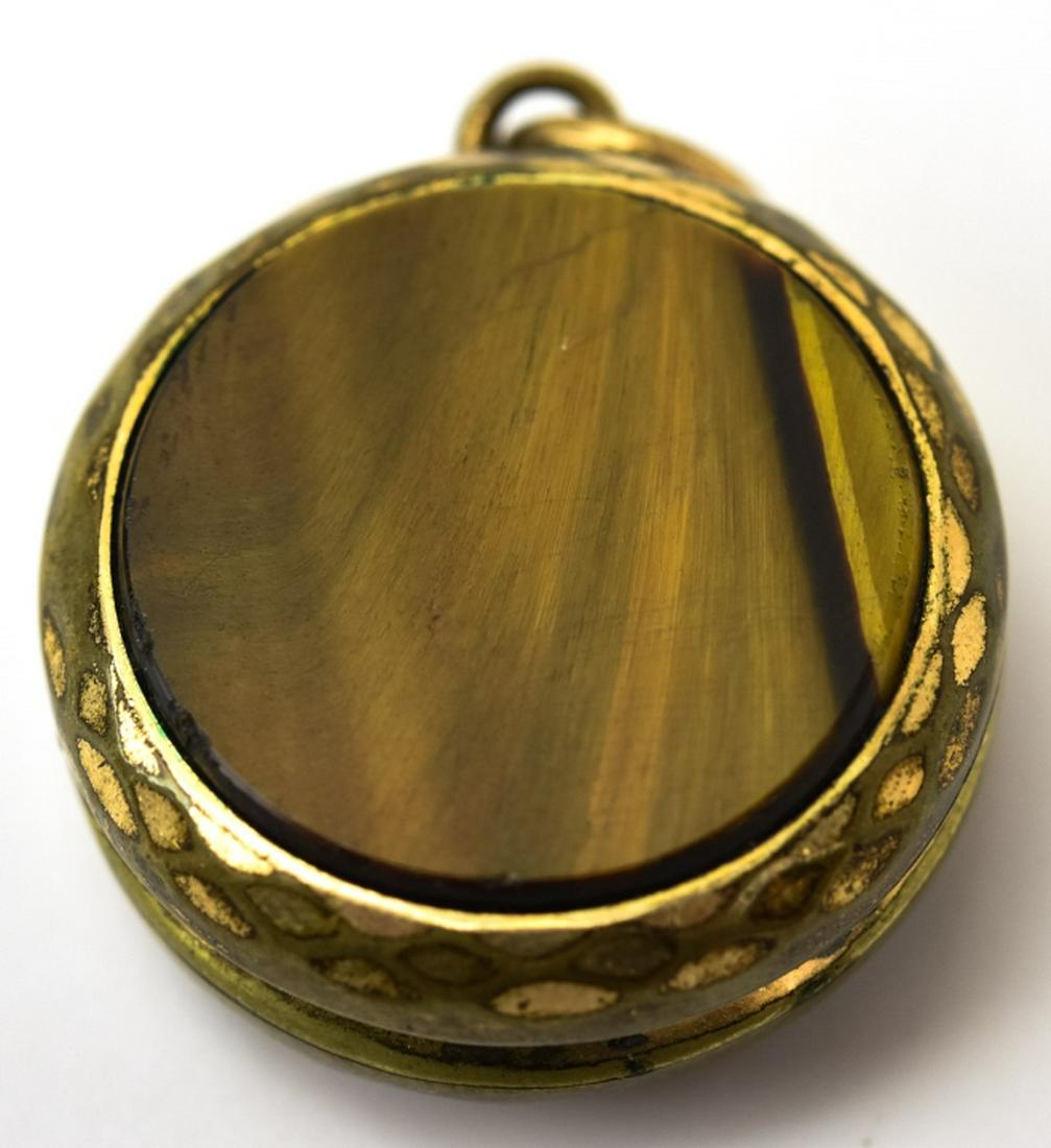 Antique 19th C Tiger's Eye & Onyx Locket Pendant: Antique 19th C Tiger's Eye & Onyx Locket Pendant. Two sided locket. Measures 1.25 inches in length.