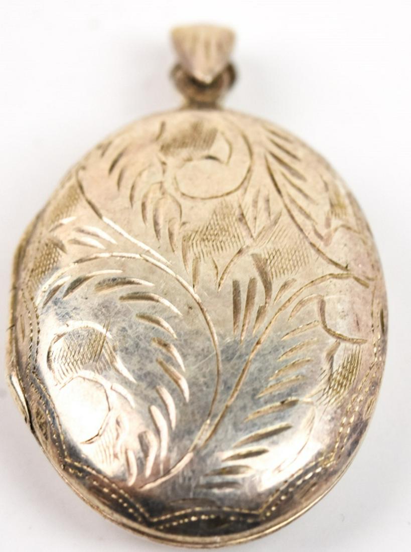 Vintage Chased Sterling Silver Locket: Vintage Chased Sterling Silver Locket or Necklace Pendant. Measures 1.75 inches in length.