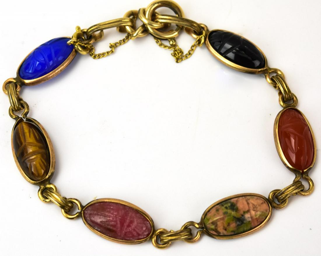 Egyptian Revival Scarab Onyx & Carnelian Bracelet: Egyptian Revival Scarab Onyx & Carnelian Bracelet. Also includes Tiger's eye and agate. Safety chain. Measures 7 inches in length.