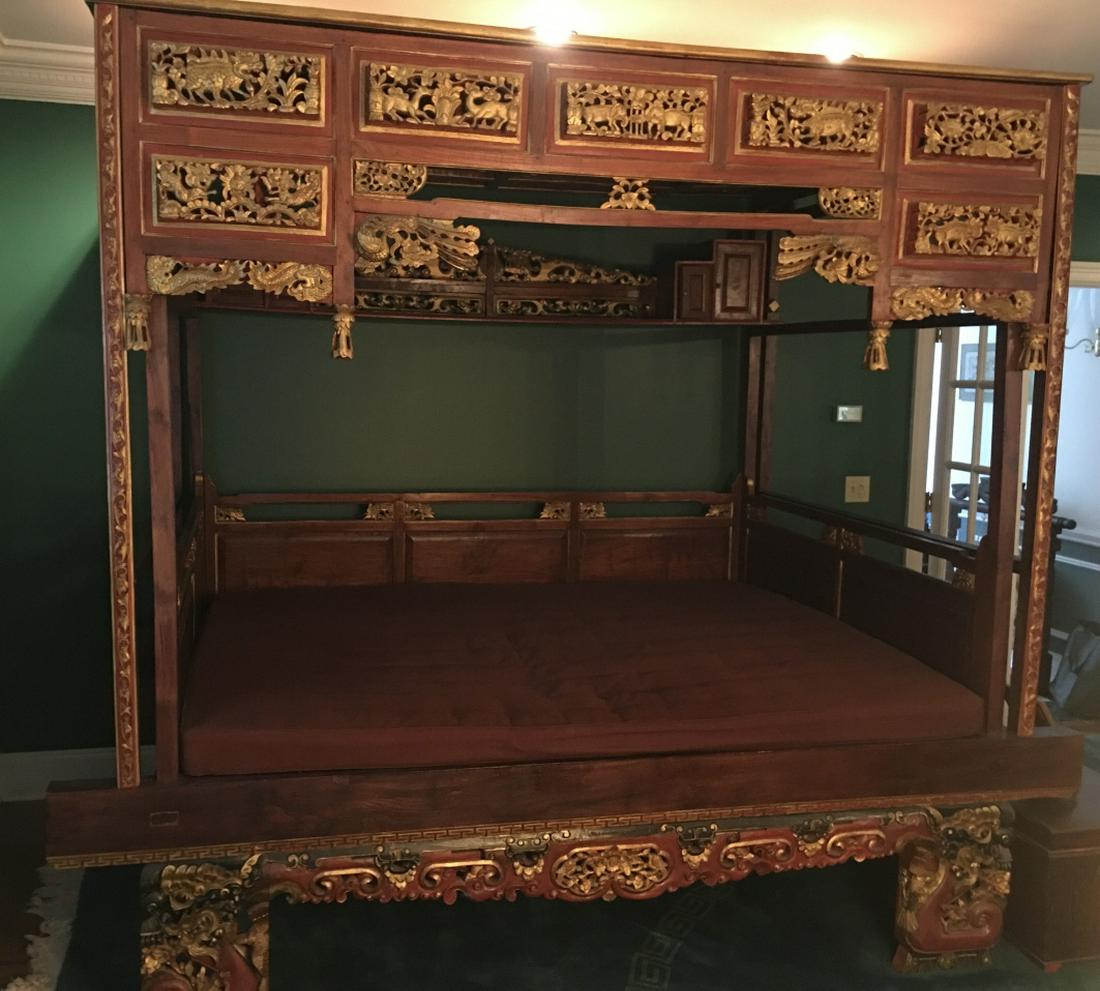 Impressive Antique Chinese Carved Opium Daybed: Impressive Antique Chinese Carved Opium Daybed. This lot features an impressive and heavily carved Chinese opium / wedding daybed. All over ornate carvings of animals and dragons with gilt details. Wi
