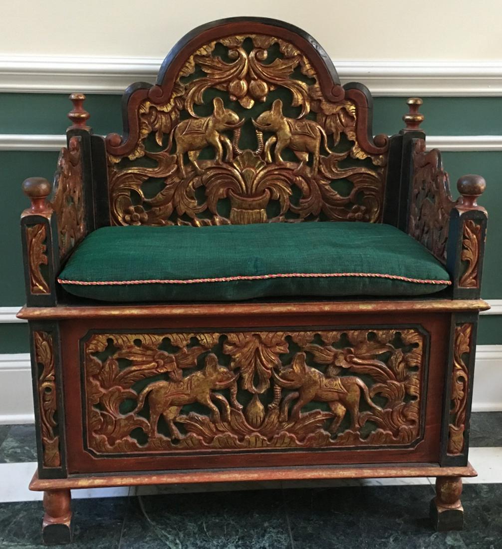 Antique Chinese Heavily Carved & Gilt Bench: Antique Chinese Heavily Carved & Gilt Bench. This lot features an antique Chinese bench with all-over carvings of elephants, flowers, and leaves with gilt details. Seat opens to reveal an interior com