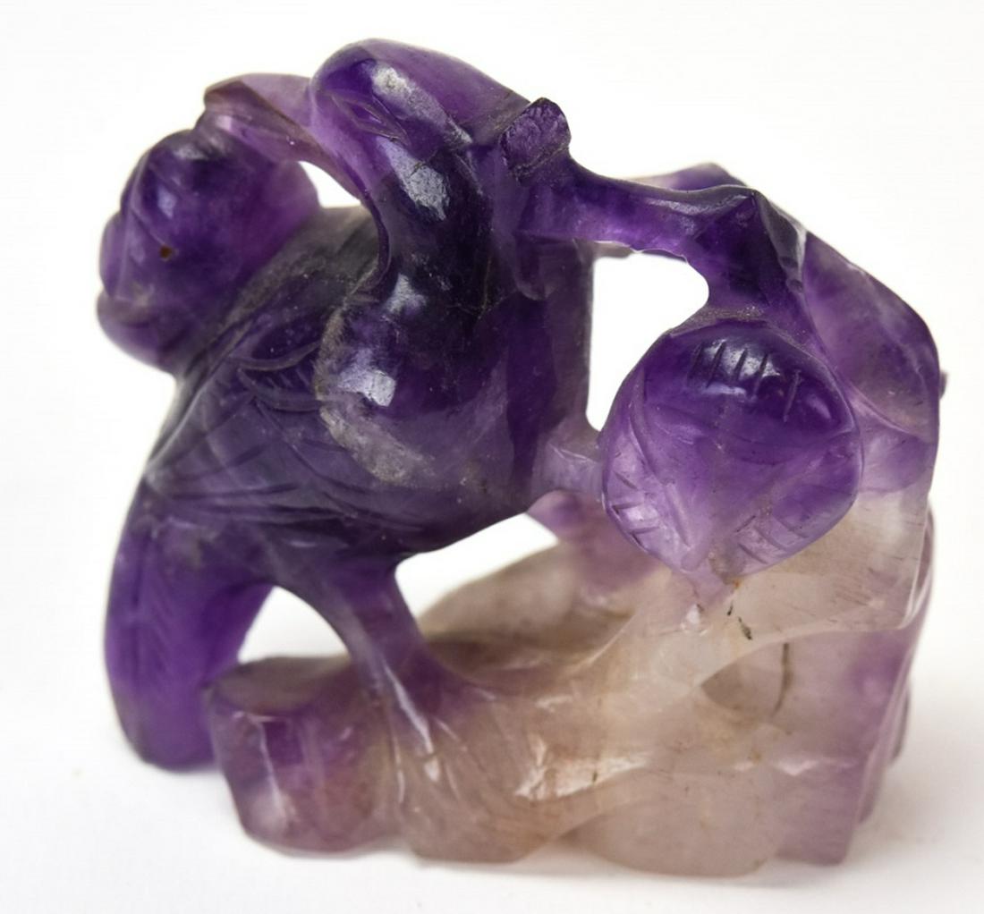 Chinese Hand Carved Amethyst Statue: Chinese Hand Carved Amethyst Statue. Figural bird and flower carved amethyst statue. 2.25 inches x 2.25 inches x 1.25 inches.