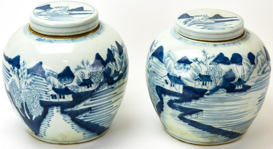 Pair Chinese Blue & White Porcelain Ginger Jars: Pair Chinese Blue & White Porcelain Ginger Jars. Pair of covered ginger jars with a blue and white landscape motif. 8 inches x 7 inches.